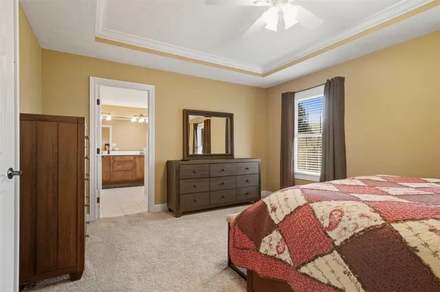 a bedroom with a bed and a dresser