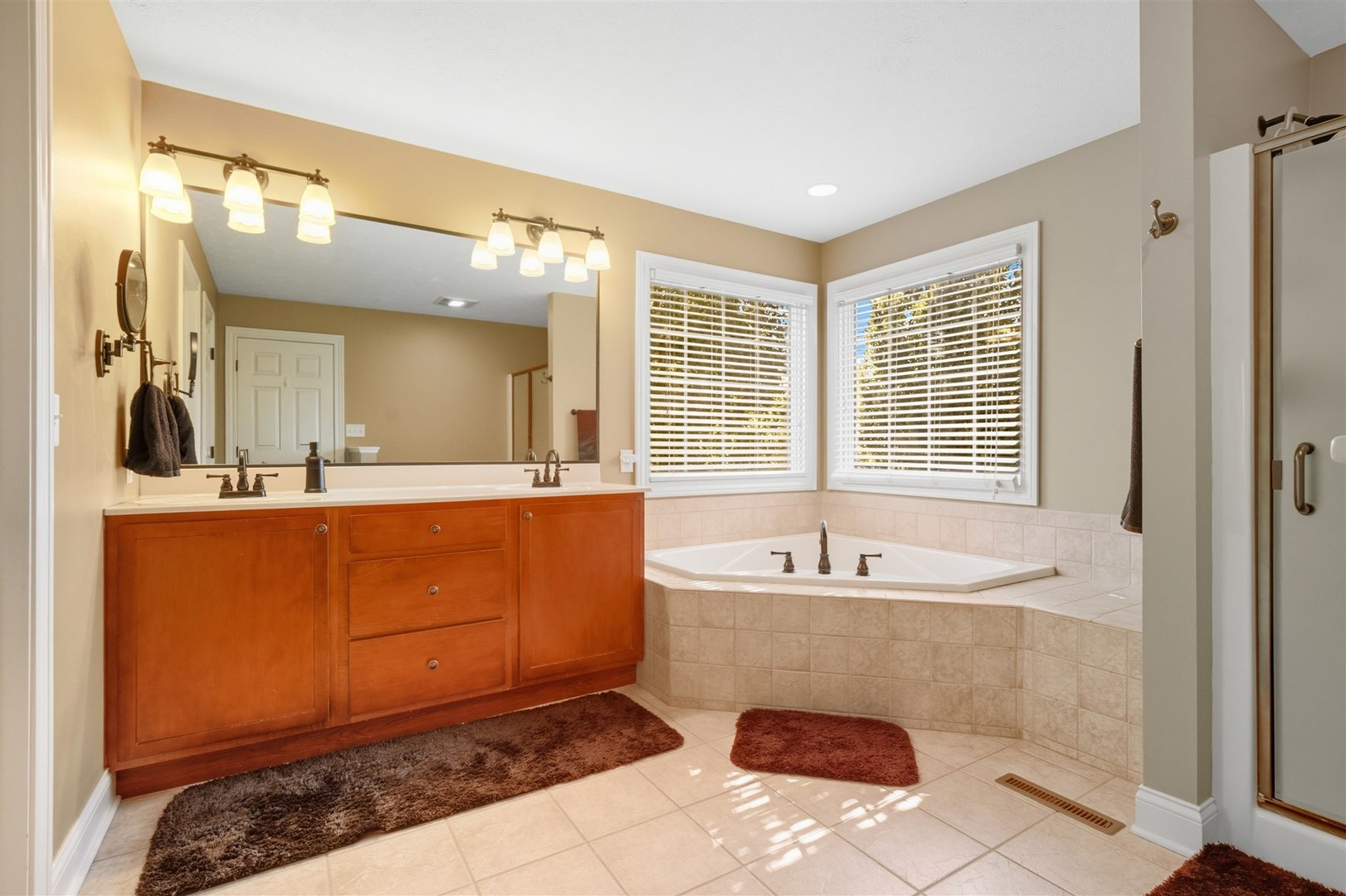 1707 Fraser Drive Normal, IL 61761 - Photo 16 of 33 a spacious bathroom with a tub sink and mirror