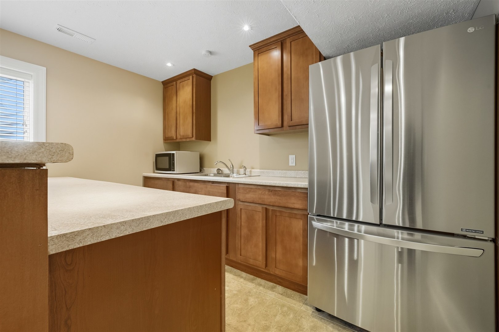 1707 Fraser Drive Normal, IL 61761 - Photo 24 of 33 a kitchen with stainless steel appliances a refrigerator sink and white cabinets