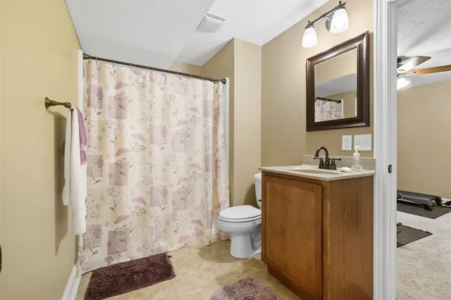 a building outdoor space with patio furniture and potted plants