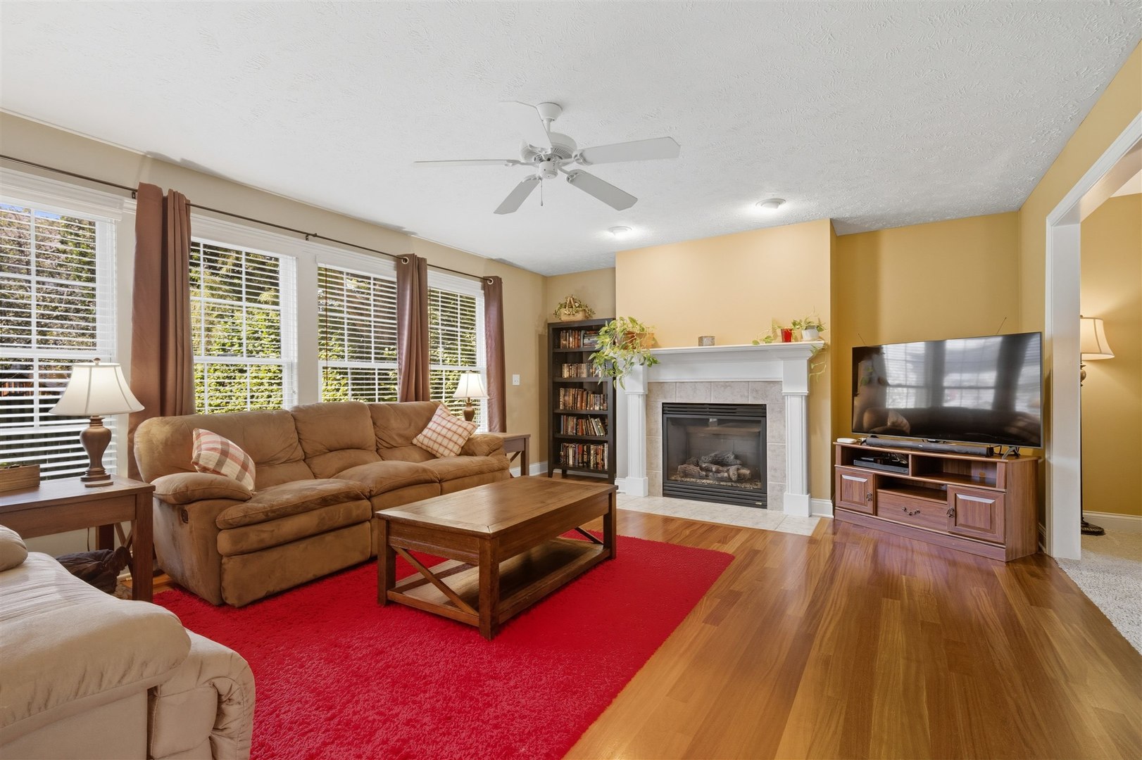 1707 Fraser Drive Normal, IL 61761 - Photo 6 of 33 a living room with furniture flat screen tv and a fireplace