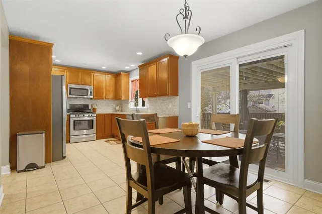 a view of a dining room with furniture window and outside view