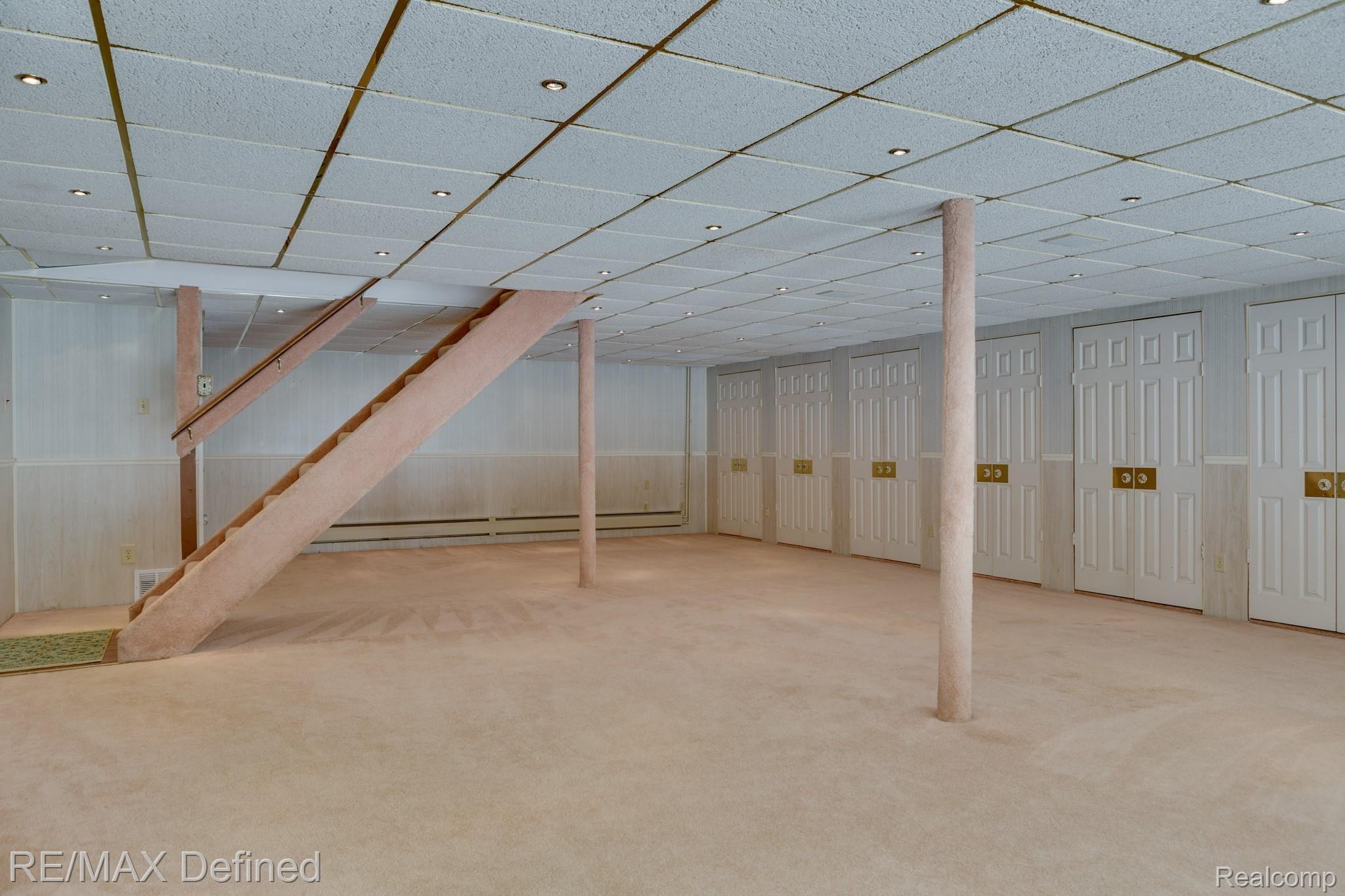 66050 Campground Road Washington, MI 48095 - Photo 25 of 31 Walkout basement with tons of storage and plenty of light.