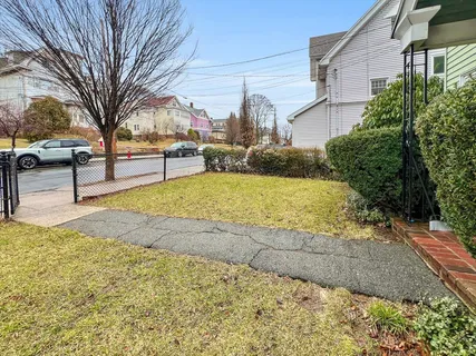 a view of a yard with a house