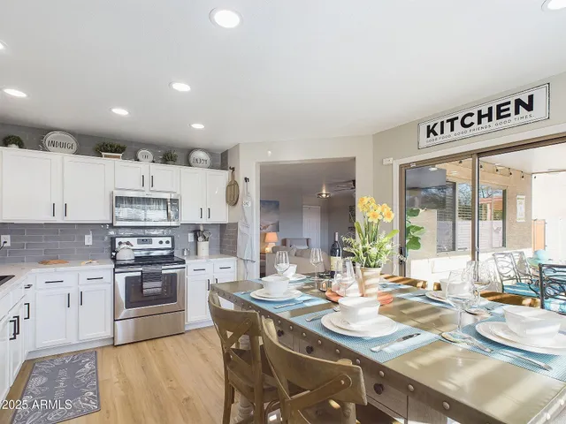 a view of a dining room with furniture window and outside view
