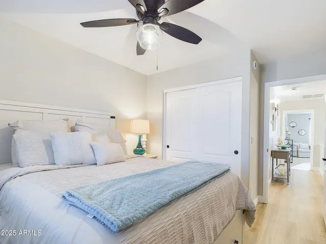 a bedroom with a bed and a lamp