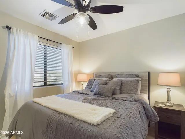 a view of a patio with table and chairs