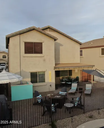 a view of a house with a yard and garage