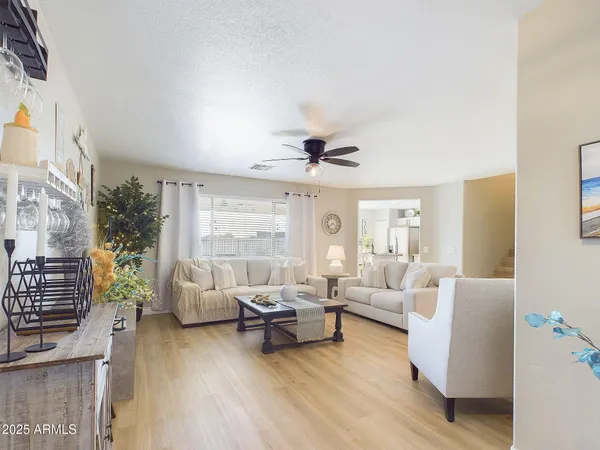a living room with furniture and a large window