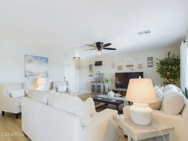 a living room with furniture and a table
