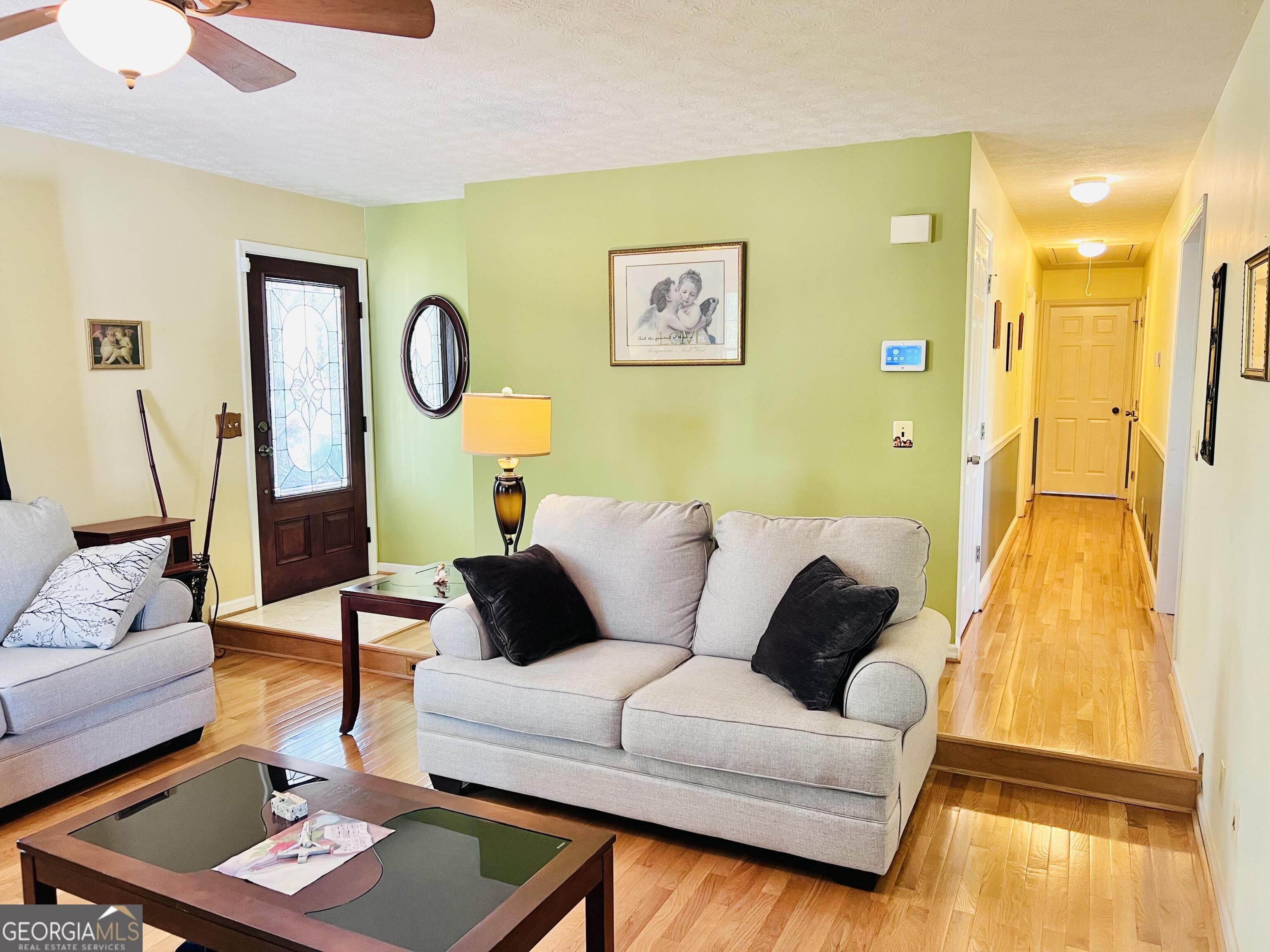 285 Wolf Den Road Royston, GA 30662 - Photo 11 of 61 a living room with furniture and a table