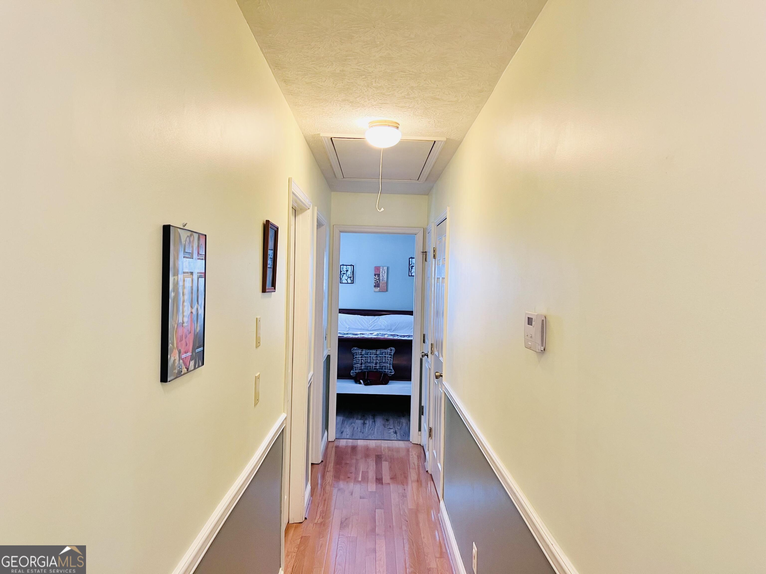 285 Wolf Den Road Royston, GA 30662 - Photo 21 of 60 a view of a hallway with wooden floor and closet