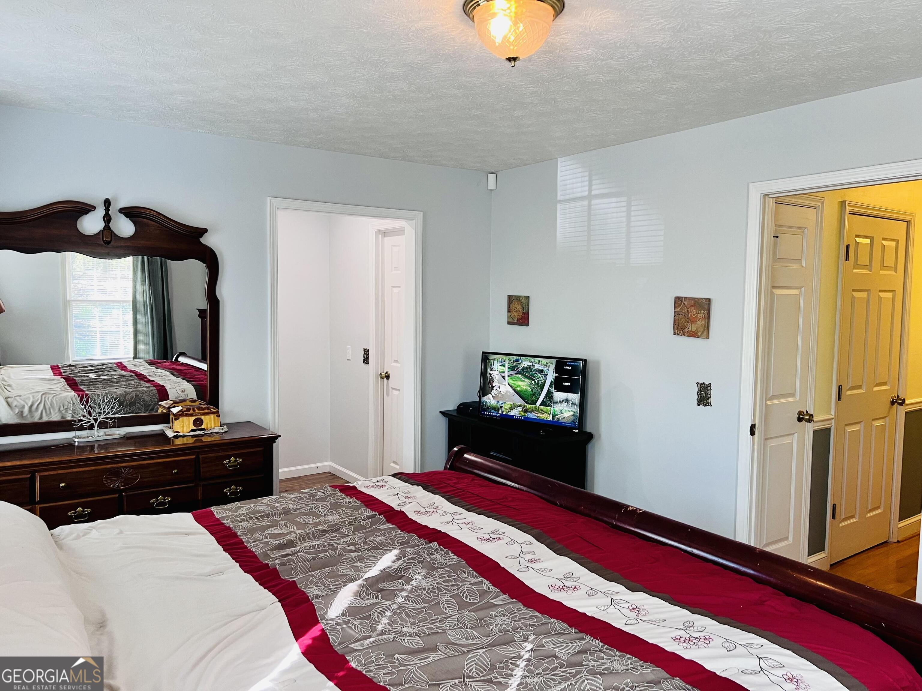 285 Wolf Den Road Royston, GA 30662 - Photo 23 of 60 a bedroom with bed and a window