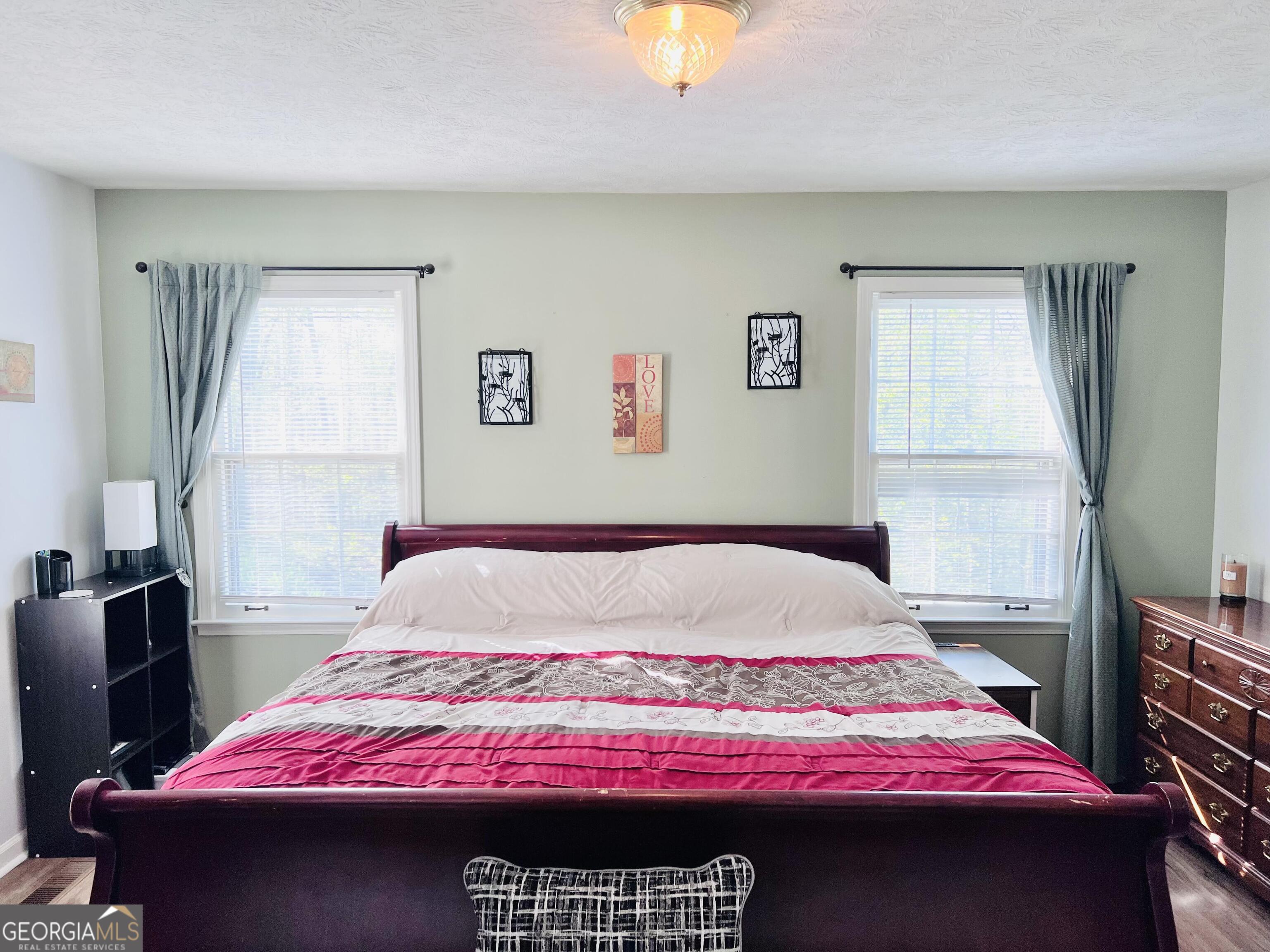 285 Wolf Den Road Royston, GA 30662 - Photo 23 of 61 a bedroom with a bed and a window