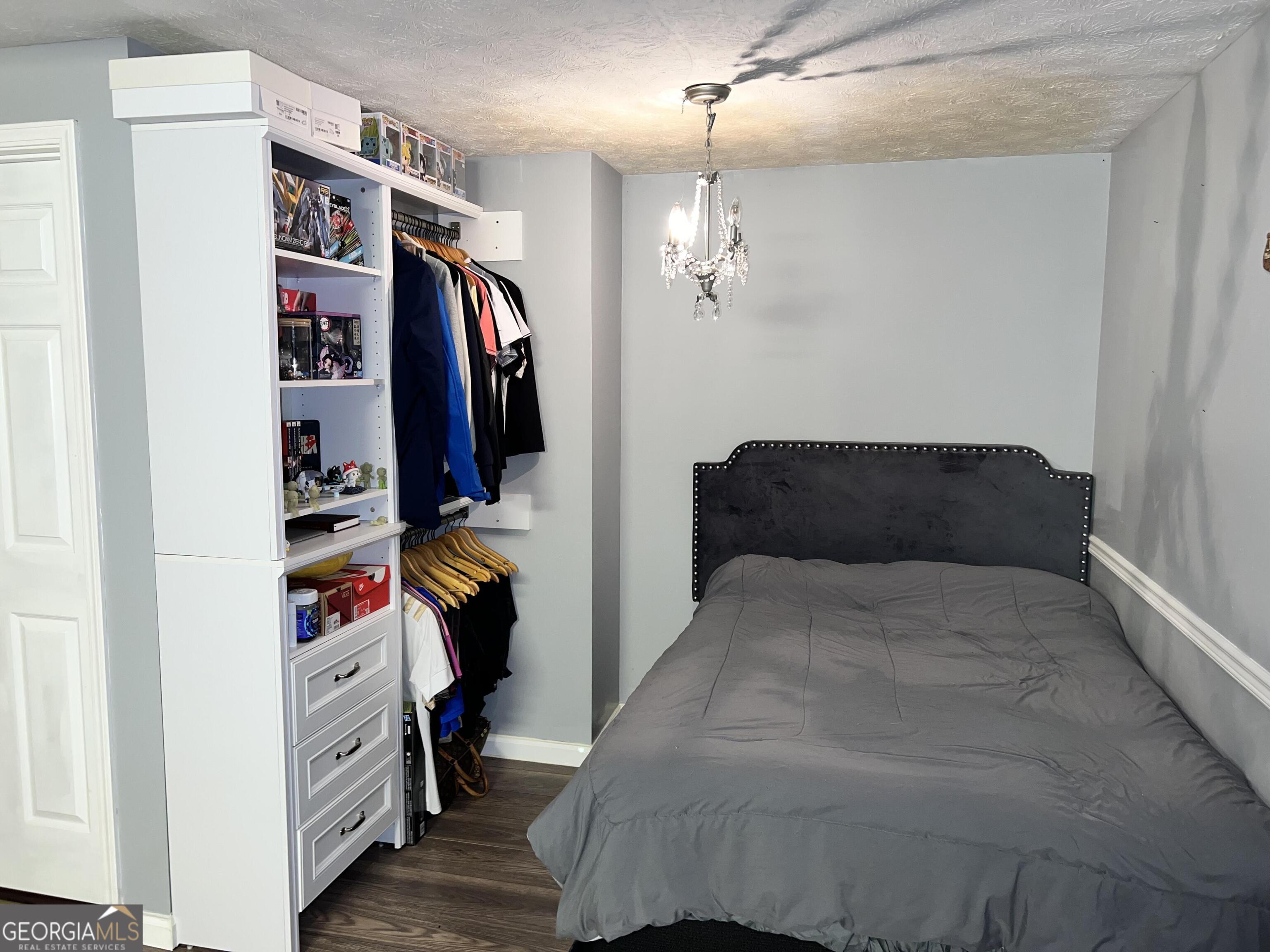 285 Wolf Den Road Royston, GA 30662 - Photo 40 of 61 a bedroom with a bed and a walk in closet