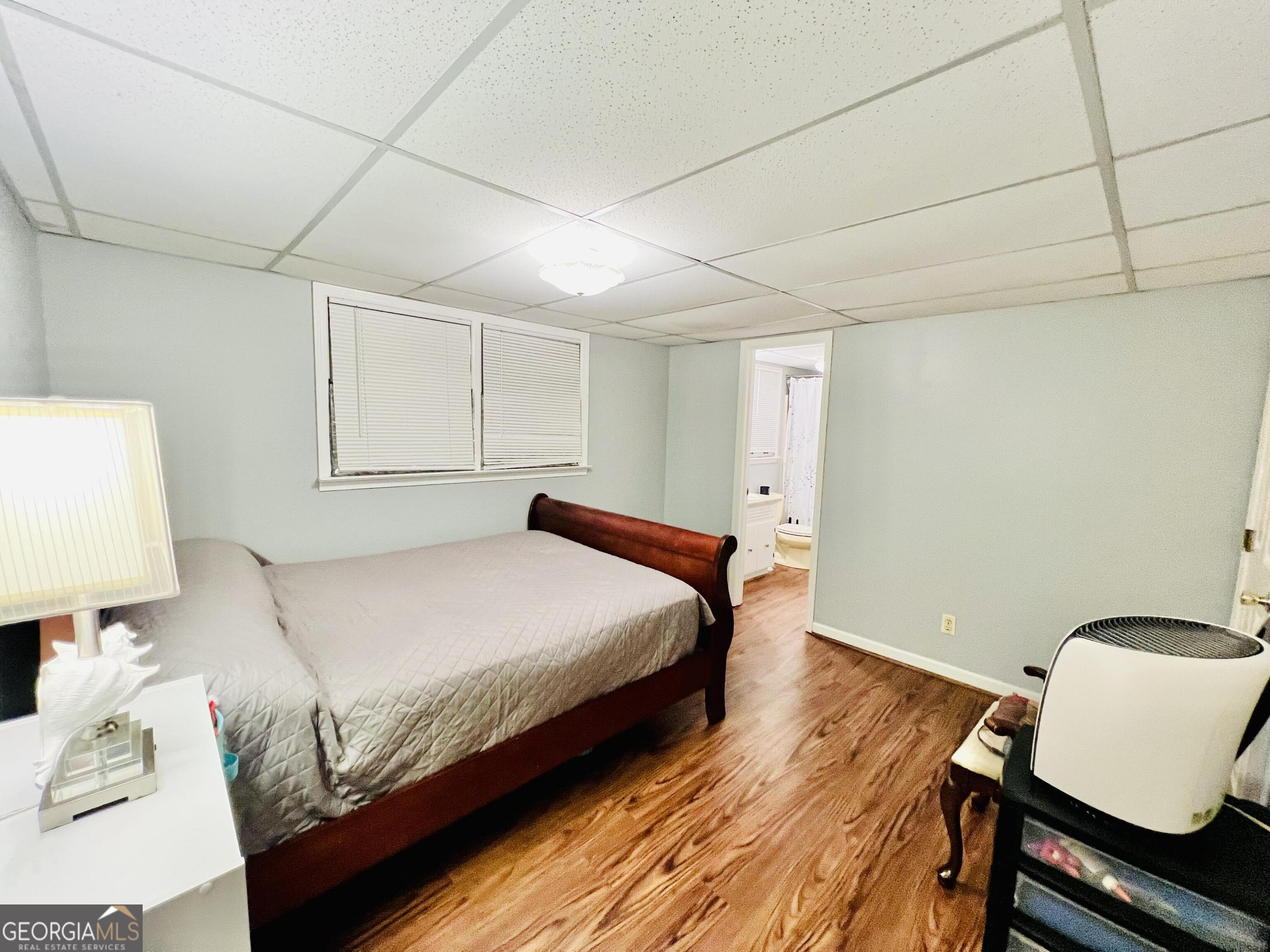 285 Wolf Den Road Royston, GA 30662 - Photo 41 of 61 a bedroom with a bed and a chair