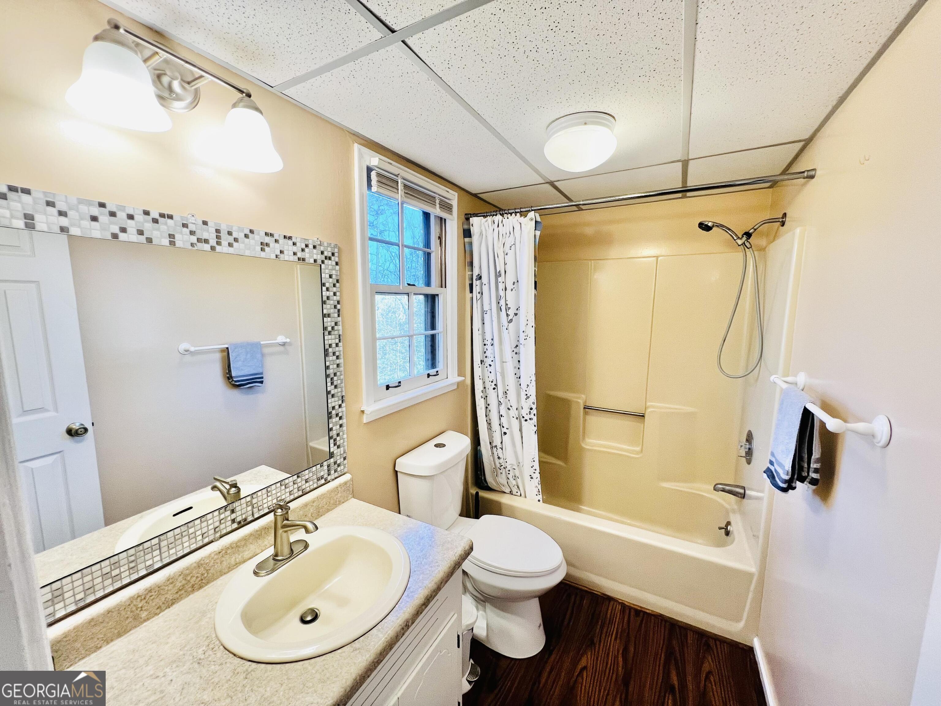 285 Wolf Den Road Royston, GA 30662 - Photo 42 of 61 a bathroom with a sink toilet tub and shower