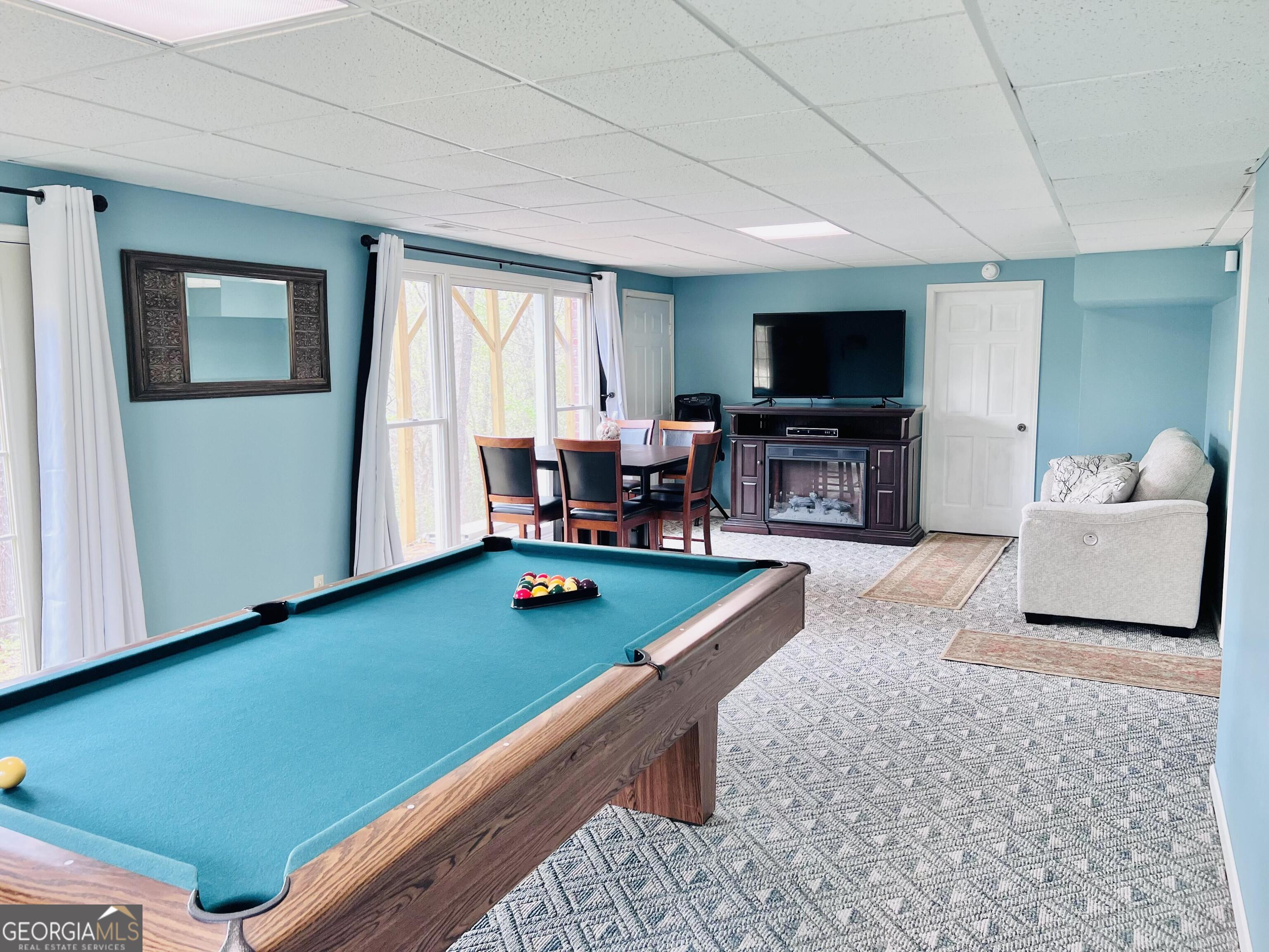 285 Wolf Den Road Royston, GA 30662 - Photo 44 of 61 a living room with furniture and a flat screen tv