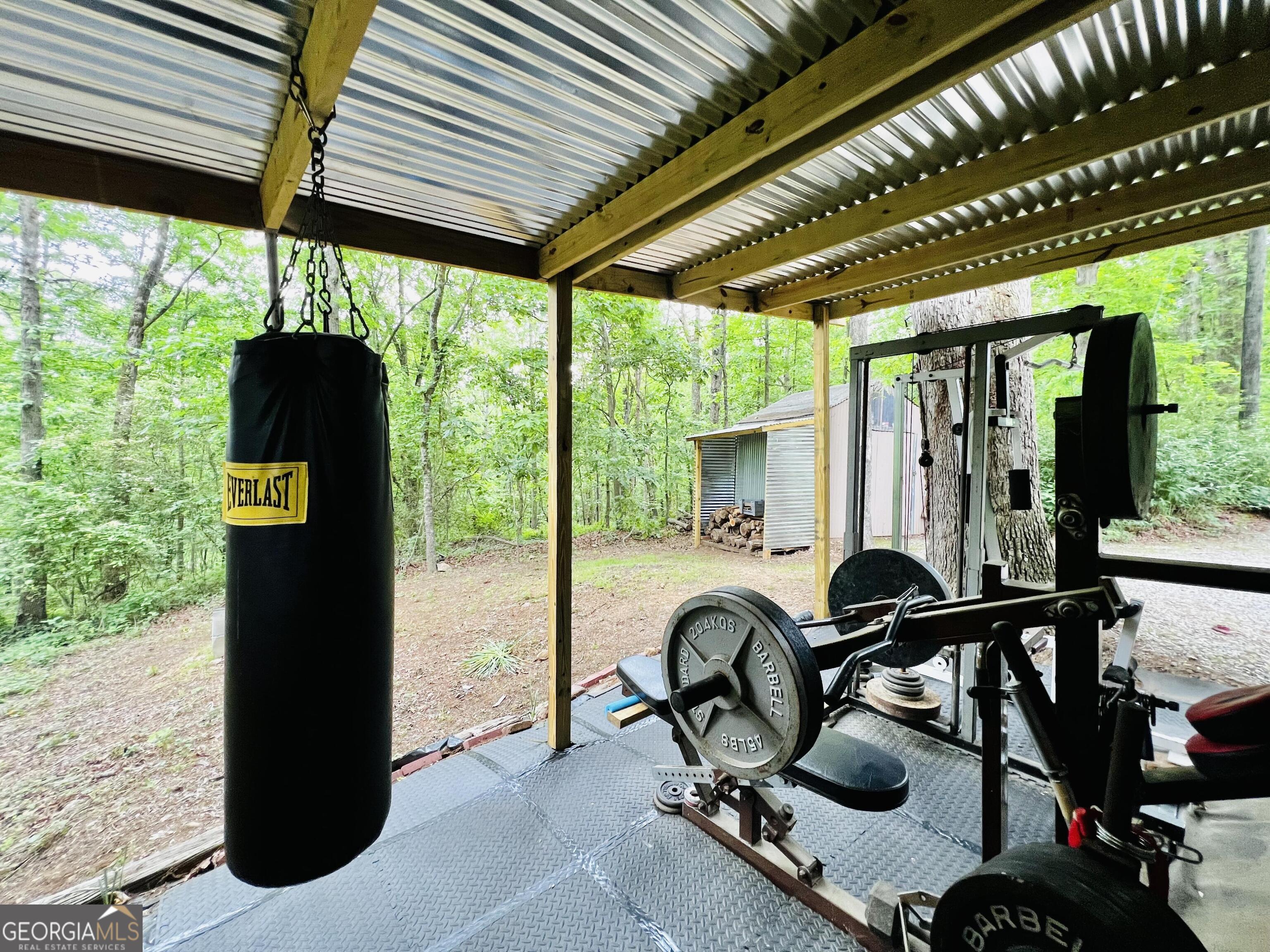 285 Wolf Den Road Royston, GA 30662 - Photo 58 of 61 a view of a patio with chairs and a table