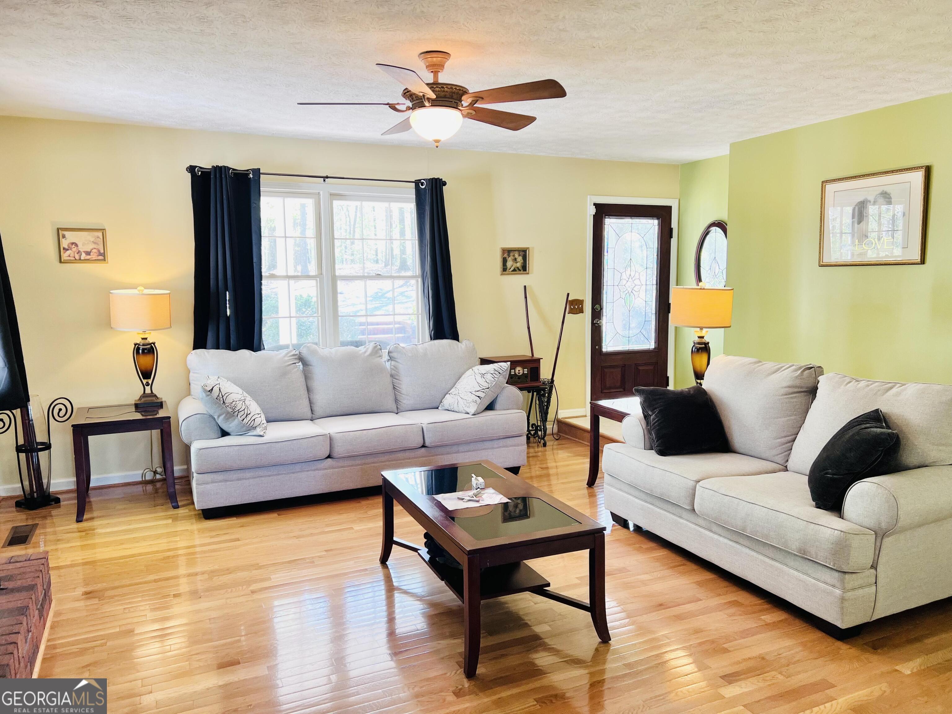 285 Wolf Den Road Royston, GA 30662 - Photo 8 of 60 a living room with furniture and a window