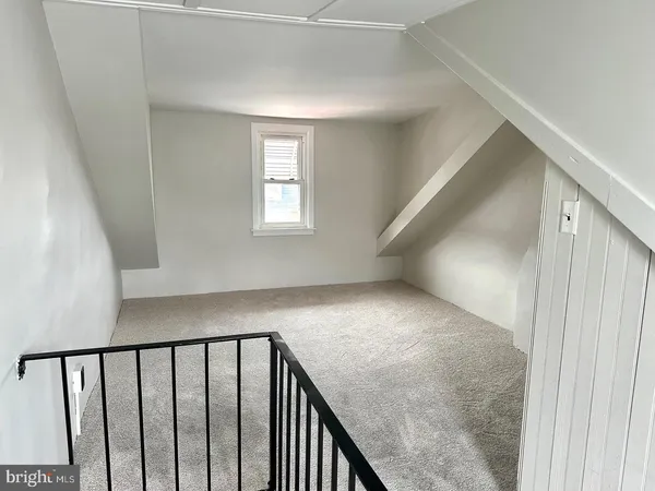 a view of a hallway with windows