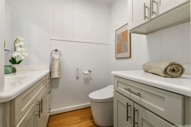 a bathroom with a sink a toilet and a shower