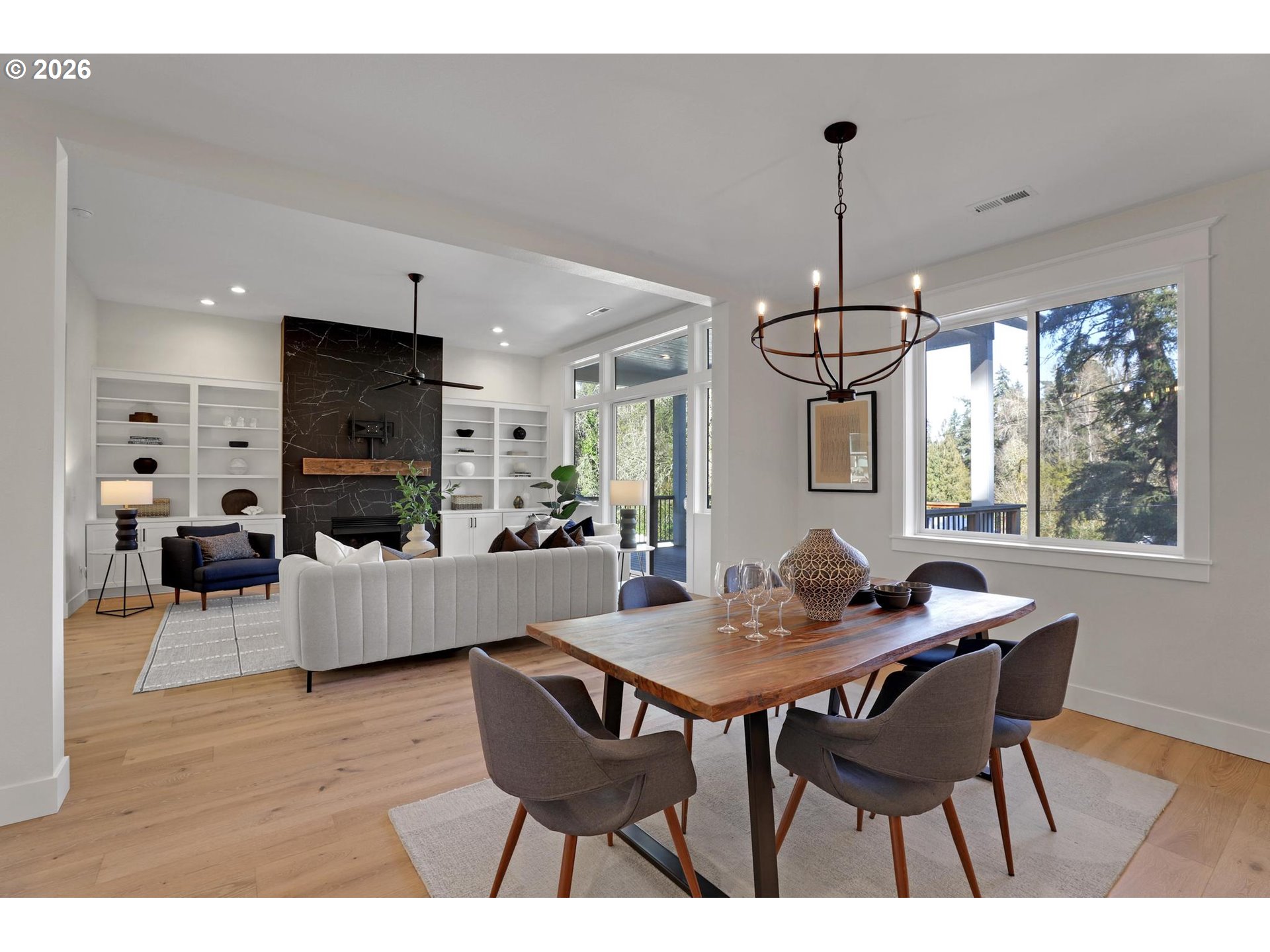 4022 Southeast Aldercrest Road Milwaukie, OR 97222 - Photo 11 of 40 a dining room with furniture a chandelier and wooden floor