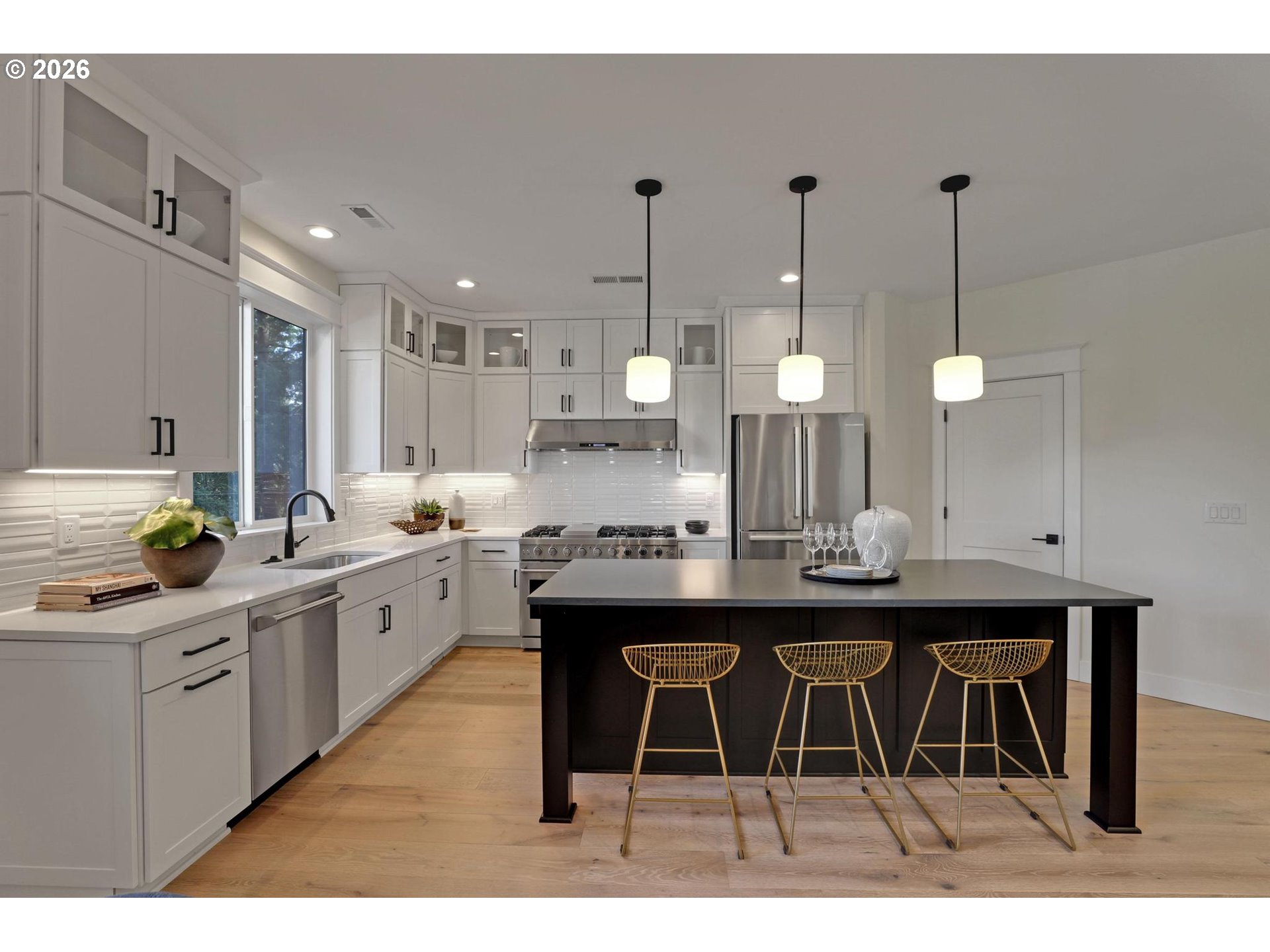 4022 Southeast Aldercrest Road Milwaukie, OR 97222 - Photo 13 of 40 a kitchen with stainless steel appliances kitchen island a chandelier