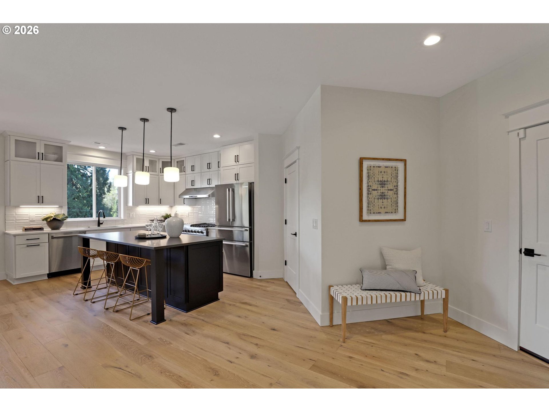 4022 Southeast Aldercrest Road Milwaukie, OR 97222 - Photo 17 of 40 a kitchen with stainless steel appliances kitchen island a refrigerator sink and cabinets