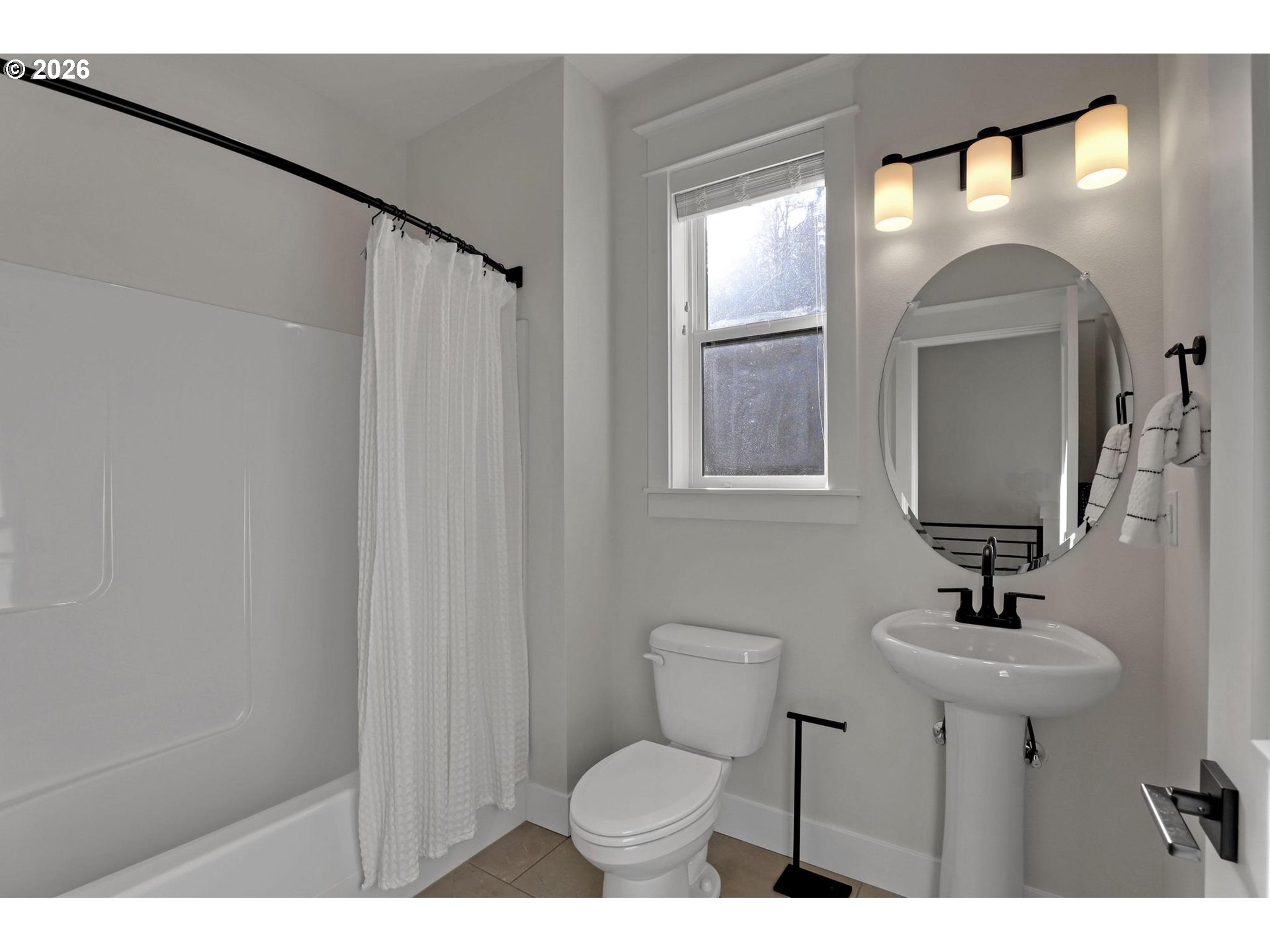 4022 Southeast Aldercrest Road Milwaukie, OR 97222 - Photo 18 of 40 a bathroom with a toilet sink and mirror