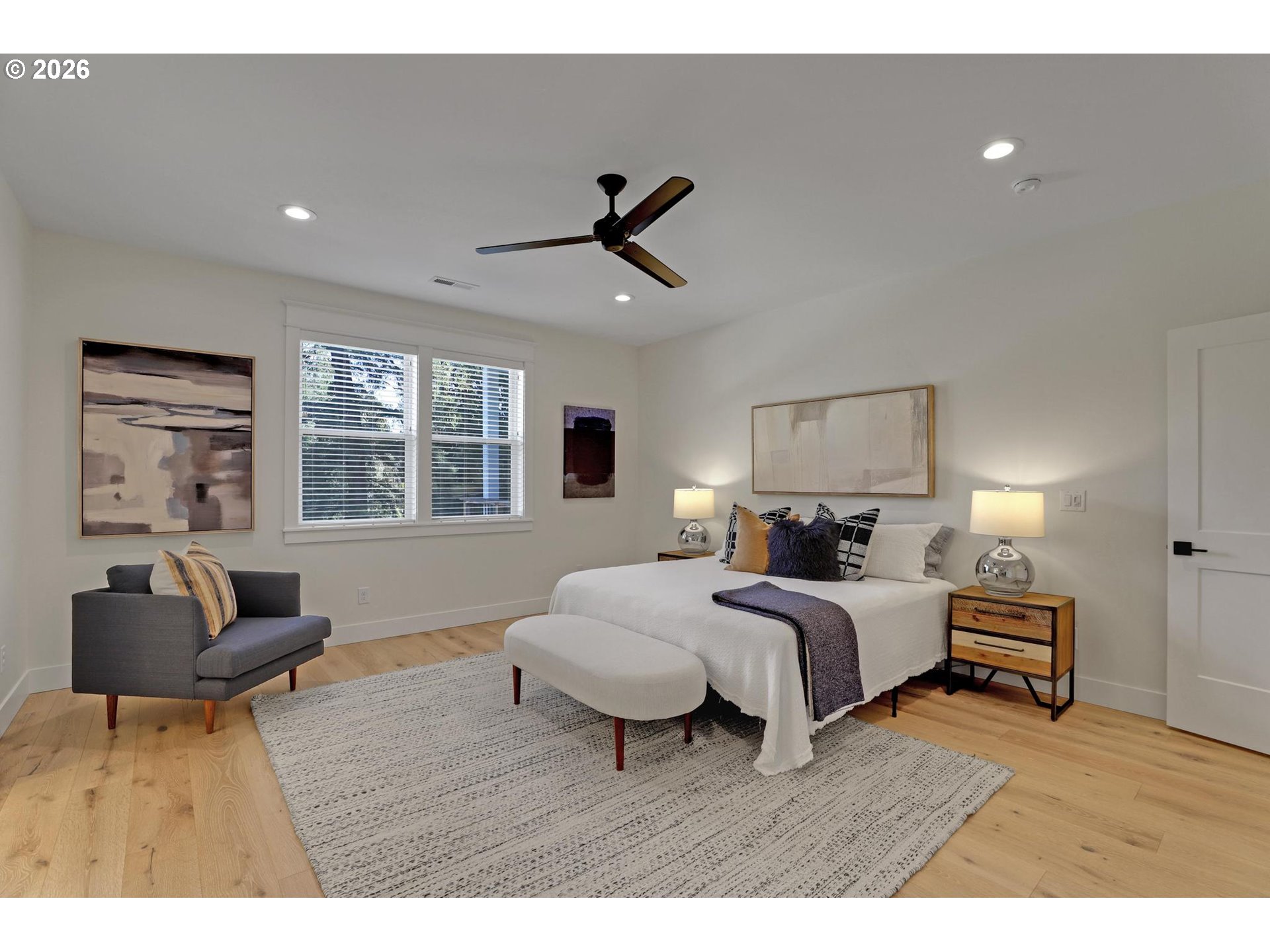 4022 Southeast Aldercrest Road Milwaukie, OR 97222 - Photo 21 of 40 a bedroom with a bed and wooden floor