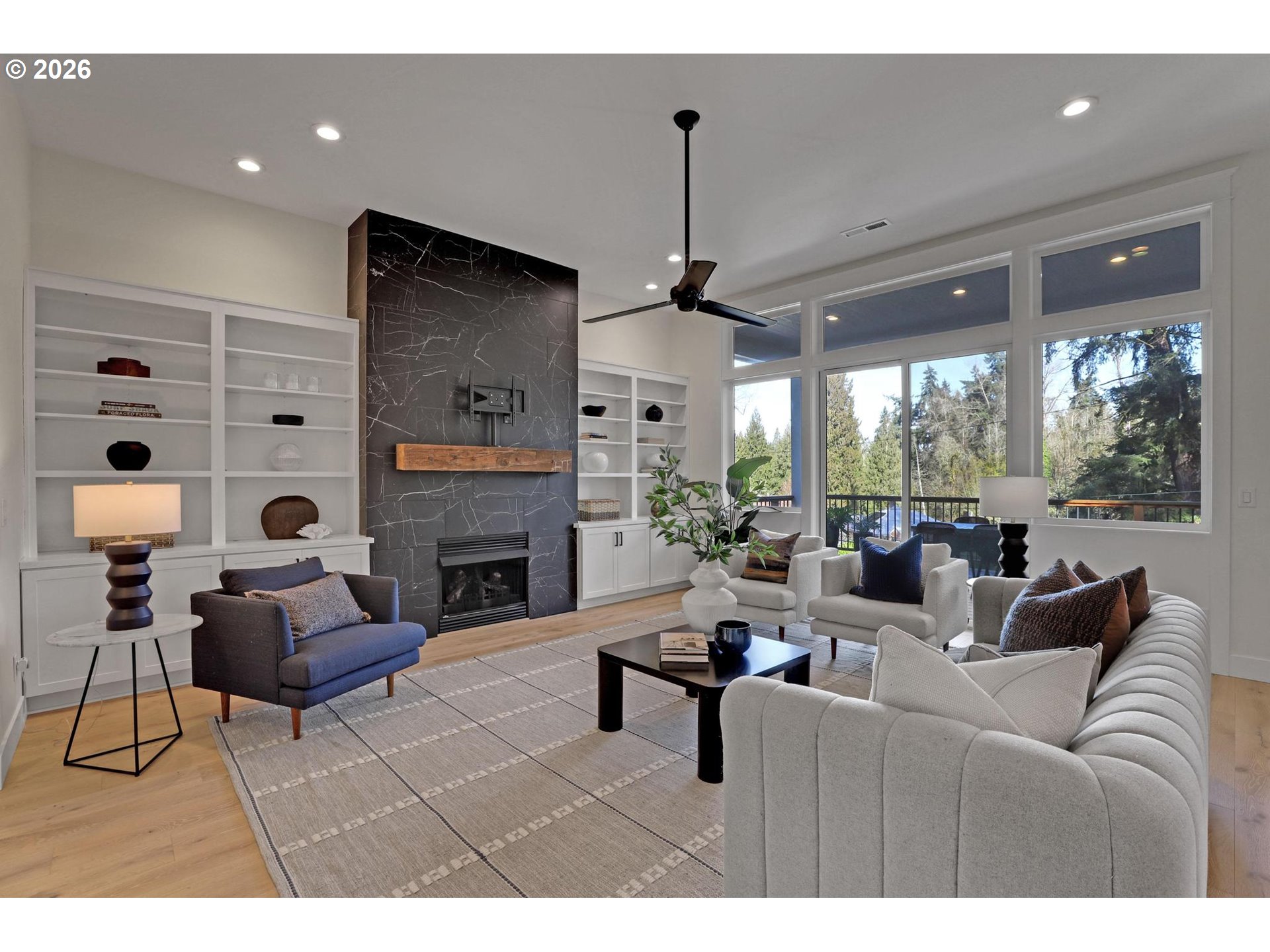 4022 Southeast Aldercrest Road Milwaukie, OR 97222 - Photo 8 of 40 a living room with furniture a fireplace and a flat screen tv