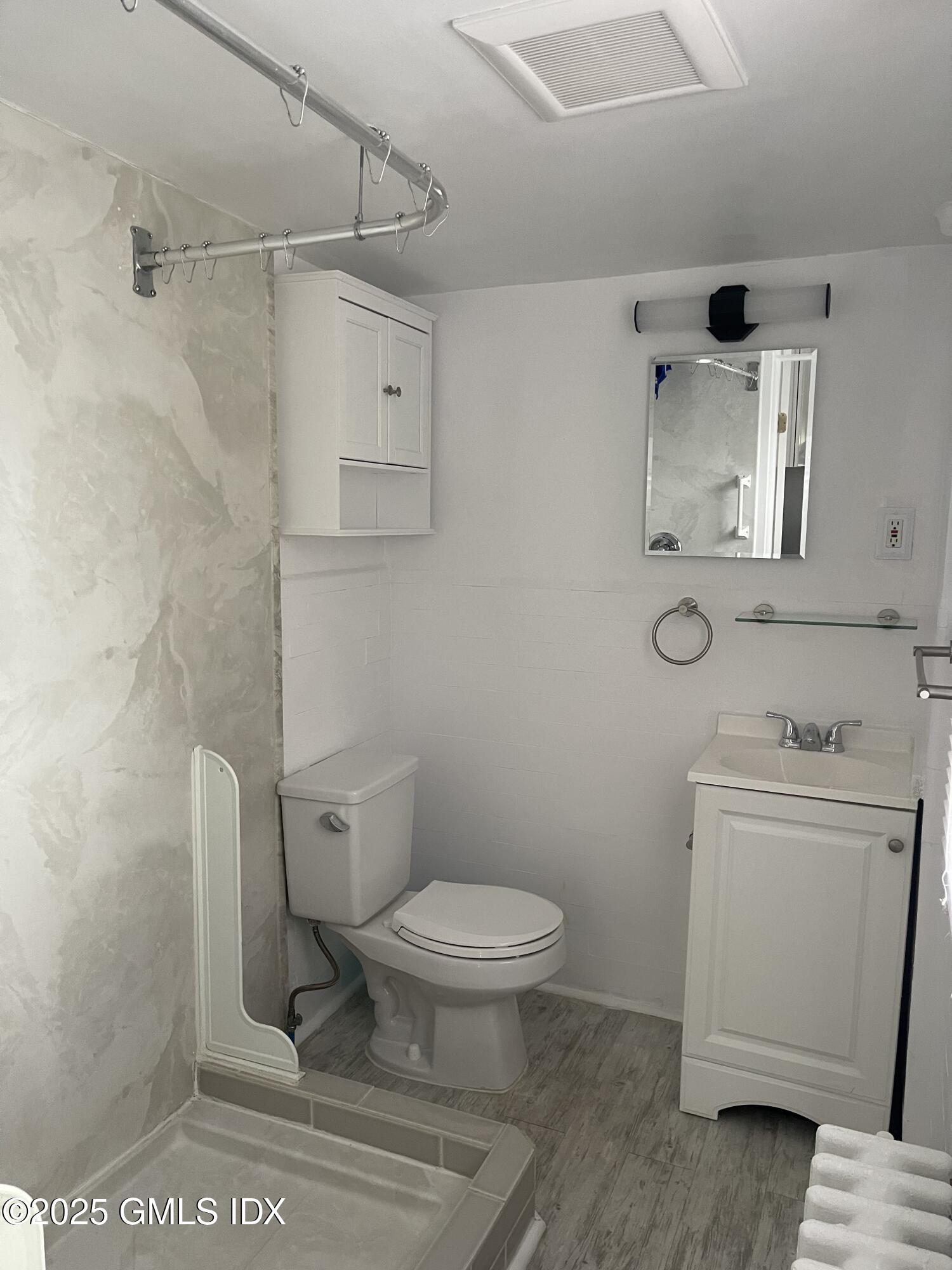 47 Cos Cob Avenue, Unit 3 Cos Cob, CT 06807 - Photo 11 of 12 a bathroom with a toilet and a sink