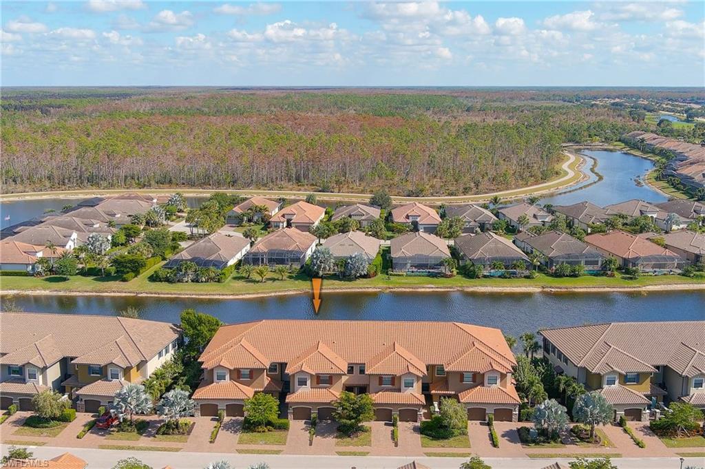 9653 Montelanico Loop, Unit 202 Naples, FL 34119 - Photo 1 of 45 a view of an ocean and a building