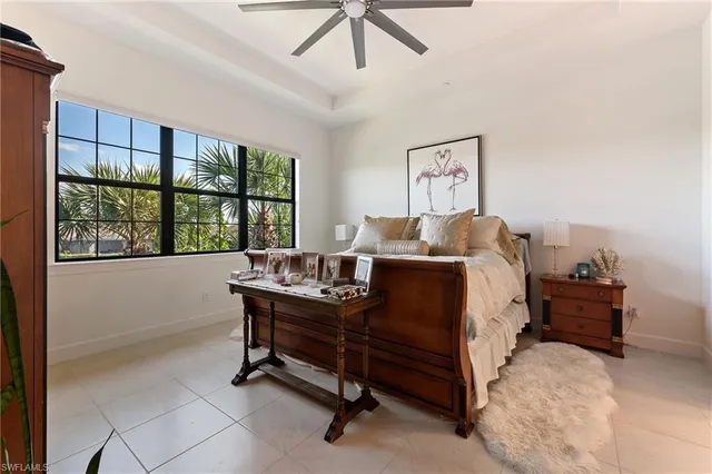 a bed room with a bed and a window