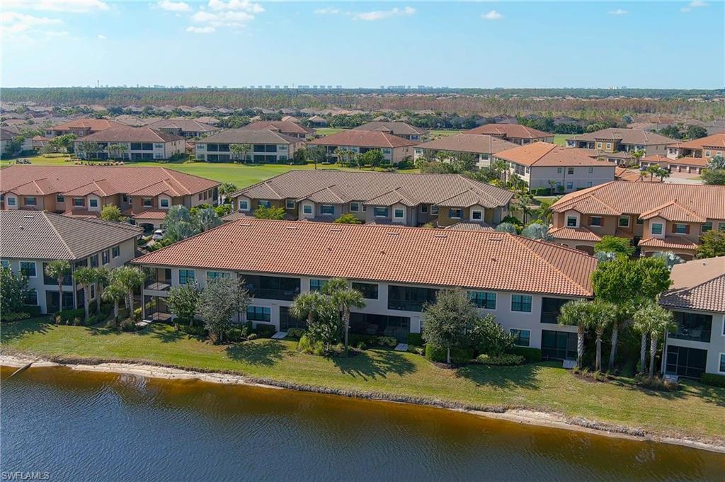 9653 Montelanico Loop, Unit 202 Naples, FL 34119 - Photo 30 of 45 an aerial view of a house with a garden