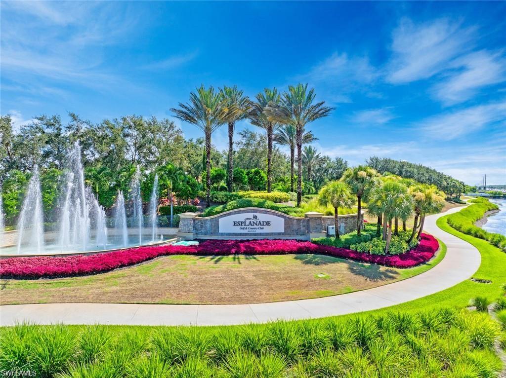 9653 Montelanico Loop, Unit 202 Naples, FL 34119 - Photo 34 of 45 a view of small space with swimming pool and trees in the background