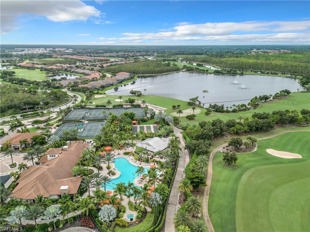 9653 Montelanico Loop, Unit 202 Naples, FL 34119 - Photo 35 of 45 a view of a lake with a city