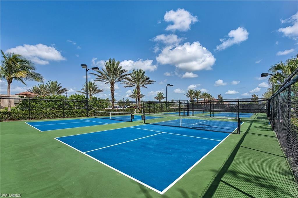 9653 Montelanico Loop, Unit 202 Naples, FL 34119 - Photo 43 of 45 a view of an outdoor space and basketball court
