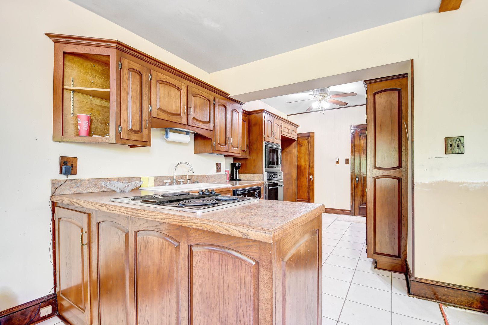 1578 Main Street Crete, IL 60417 - Photo 15 of 38 a kitchen that has a cabinets and a stove