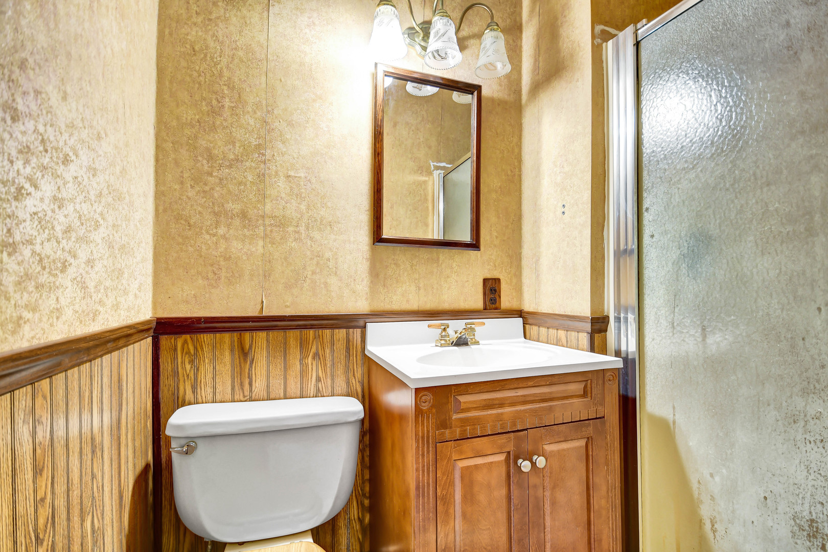 1578 Main Street Crete, IL 60417 - Photo 23 of 38 a bathroom with a sink a toilet and a mirror