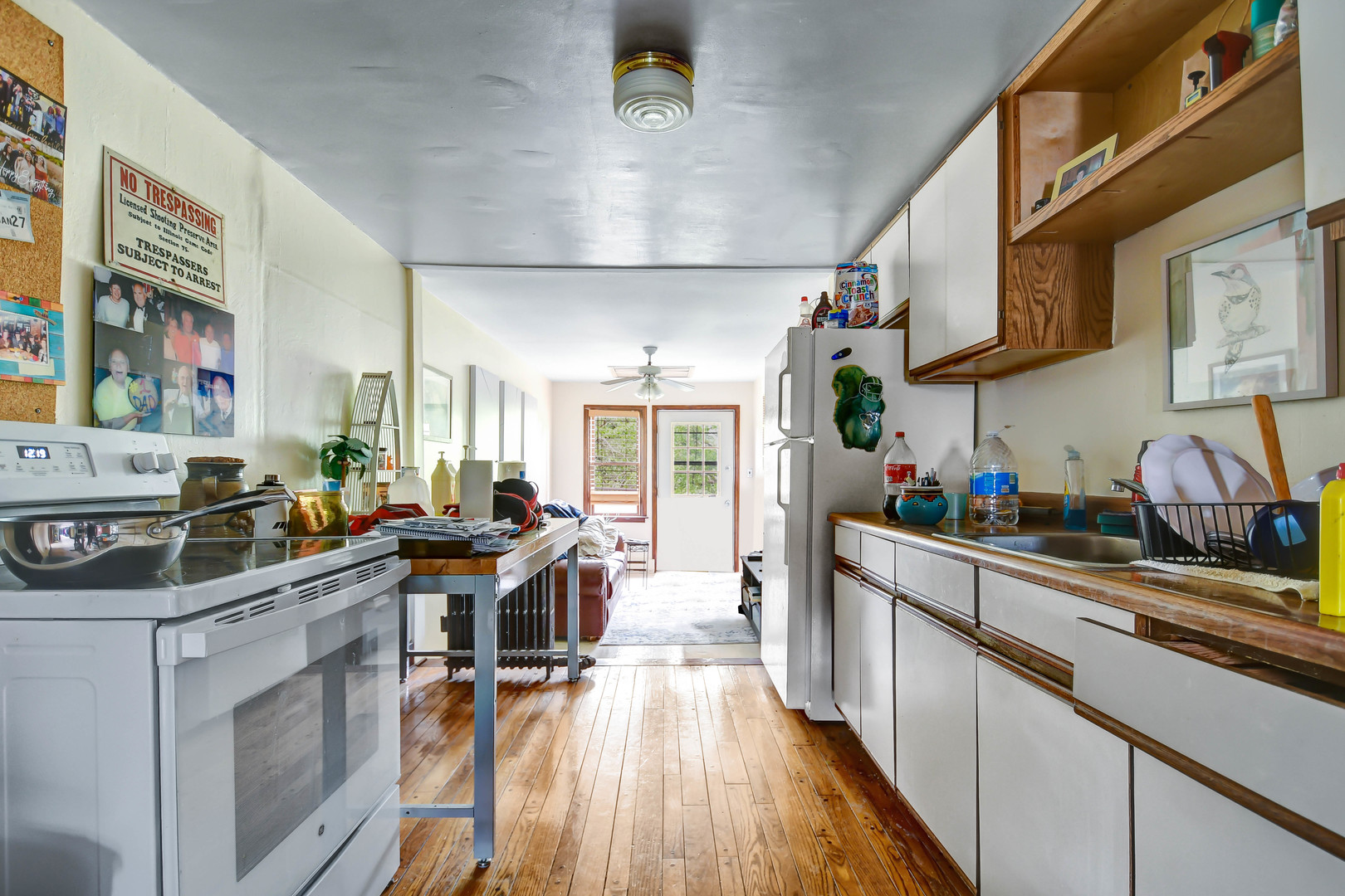 1578 Main Street Crete, IL 60417 - Photo 26 of 38 a view of a kitchen with fridge and wooden floor