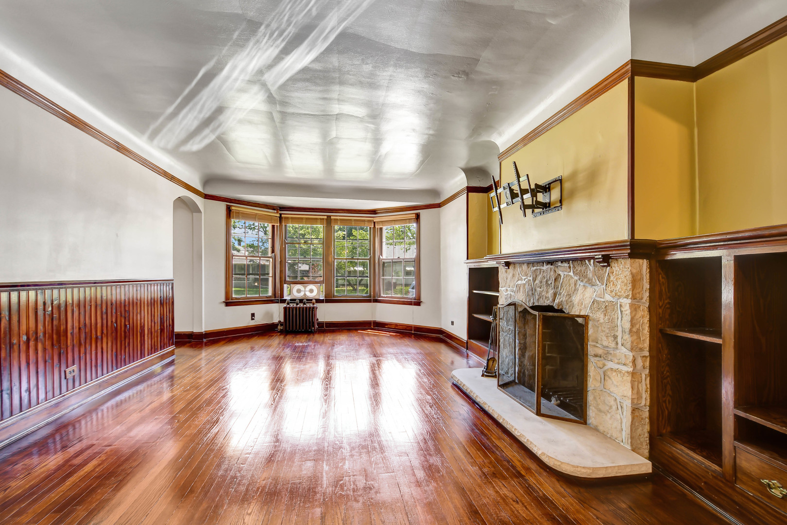 1578 Main Street Crete, IL 60417 - Photo 5 of 38 a view of an empty room with wooden floor fireplace and a window