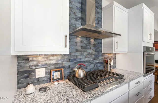 a kitchen with a stove and a cabinets