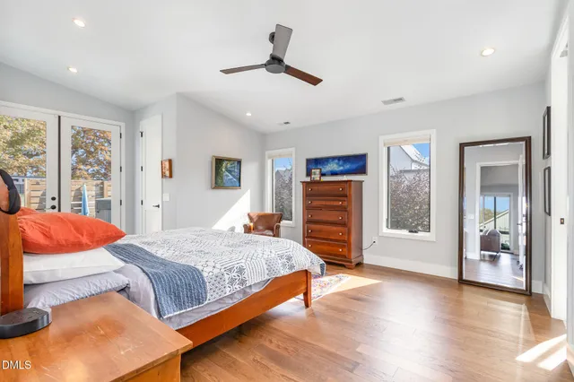 a bedroom with a bed and dresser