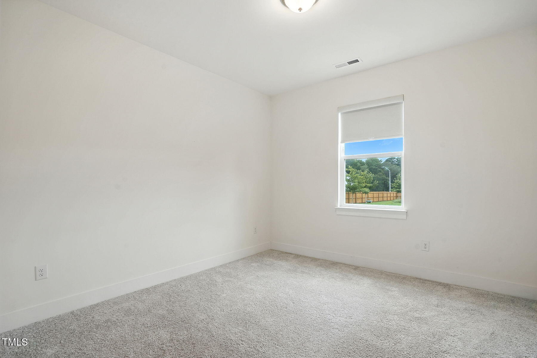 801 Mdw Frd Way Willow Spring, NC 27592 - Photo 14 of 36 an empty room with windows