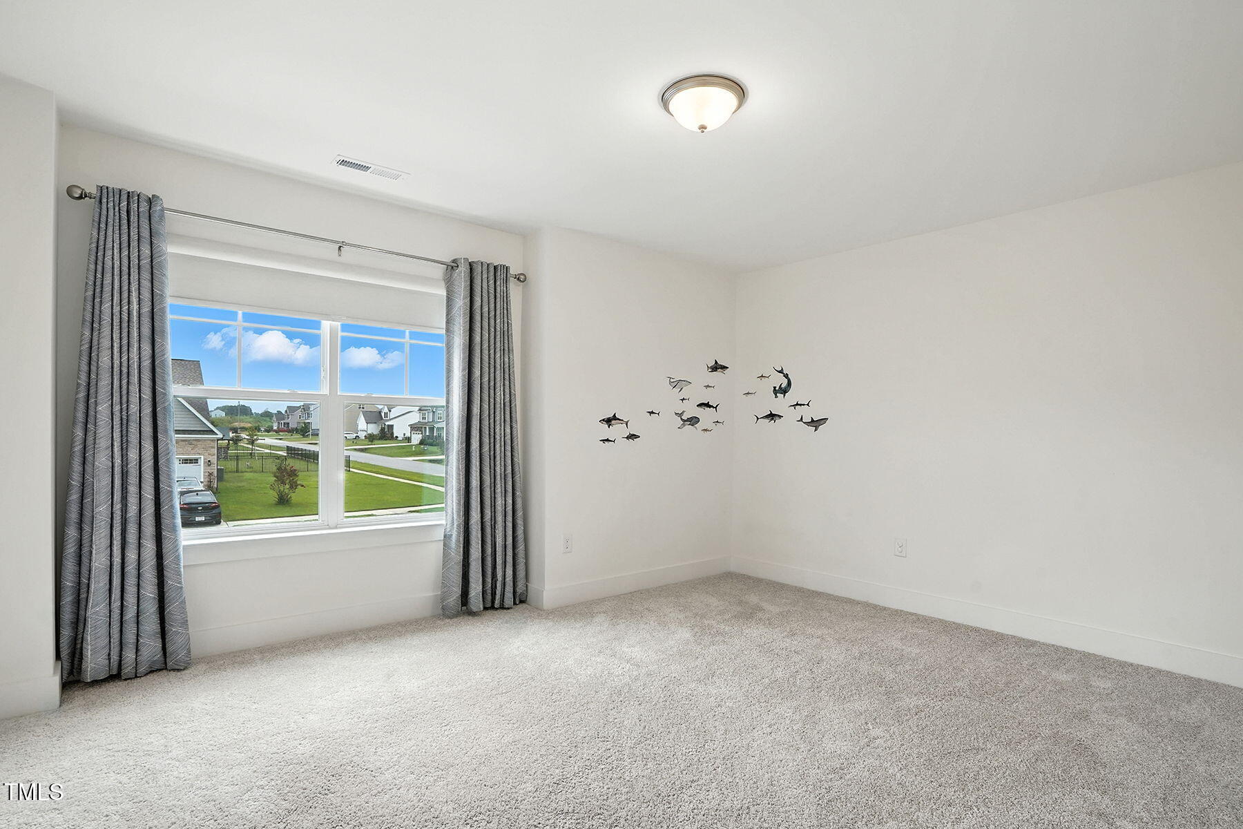 801 Mdw Frd Way Willow Spring, NC 27592 - Photo 18 of 36 a view of an empty room with a window