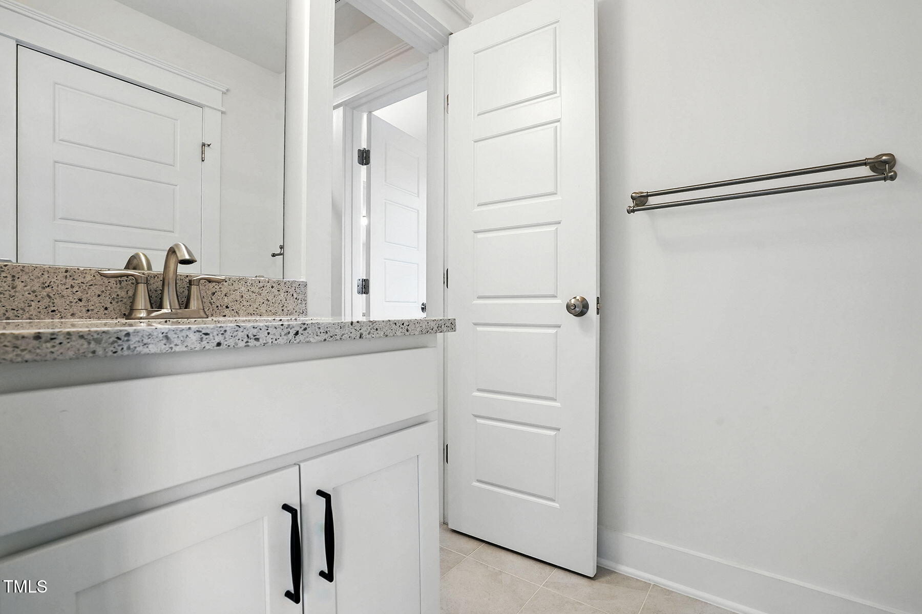 801 Mdw Frd Way Willow Spring, NC 27592 - Photo 20 of 36 a bathroom with a sink and a mirror