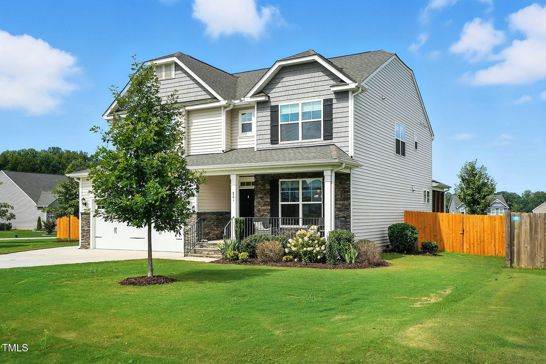 801 Mdw Frd Way Willow Spring, NC 27592 - Photo 2 of 36 a front view of a house with a yard
