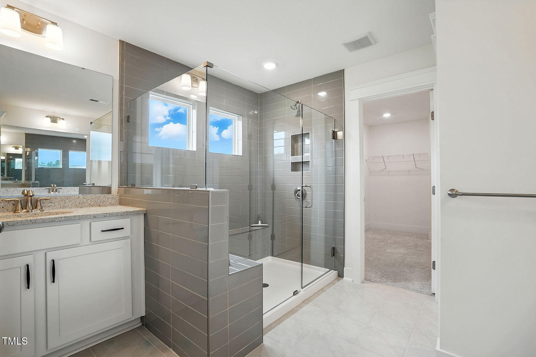 801 Mdw Frd Way Willow Spring, NC 27592 - Photo 26 of 36 a bathroom with a granite countertop sink mirror and shower
